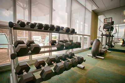 a gym with a bunch of chairs in a room at SpringHill Suites by Marriott Canton in North Canton