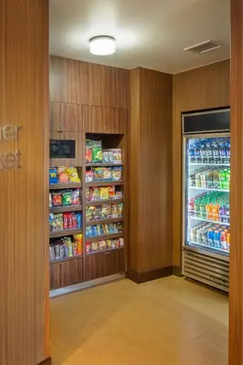 a room with a refrigerator filled with lots of food at Fairfield Inn and Suites by Marriott Monaca in Monaca