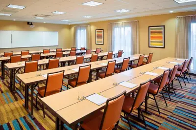 a large room with tables and chairs in a classroom at Fairfield Inn and Suites by Marriott Monaca in Monaca