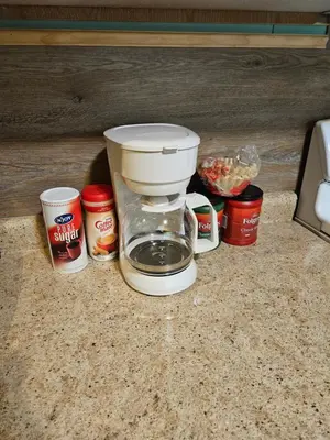 a coffee maker sitting on top of a counter at Frog Hollow at Hocking Vacations in Logan