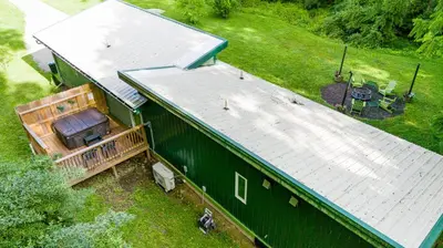 an overhead view of a green barn with a metal roof at Frog Hollow at Hocking Vacations in Logan