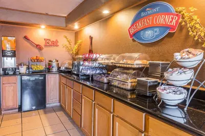 a kitchen with a counter with food on it at Baymont by Wyndham Lancaster in Lancaster