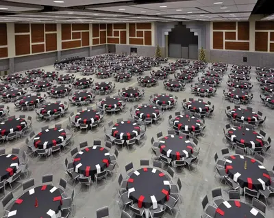 a large room filled with black tables and chairs at DoubleTree by Hilton Lawrenceburg in Lawrenceburg