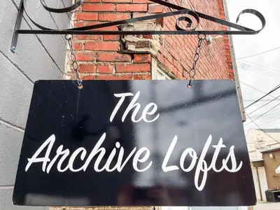 a sign that reads the arctic lobos hanging from a building at The Baker The Archive Lofts in Marion