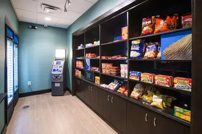 a grocery store aisle with a vending machine and food at Hampton Inn & Suites Toledo/Westgate in Toledo