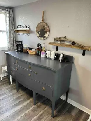 a gray dresser in a room with a window at Lakeside Oasis/Golf Cart/Beach in Luna Pier