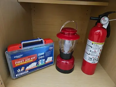 a red blender and a fire extinguisher on a shelf at Grey Pines at Hocking Vacations in Logan