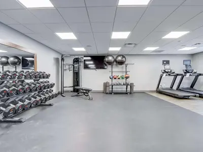 a gym with lots of equipment in a room at Hampton Inn & Suites Cincinnati Midtown Rookwood in Cincinnati