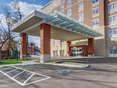 awning over a parking lot in front of a building at Hampton Inn & Suites Cincinnati Midtown Rookwood in Cincinnati
