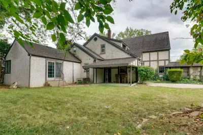an exterior view of a house with a yard at Historic Auburn Home with Theater and Yard! in Auburn