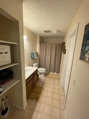 a bathroom with a toilet and a sink at Home sweet home in Columbus