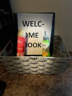 a basket with bottles and a sign on a counter at Home sweet home in Columbus