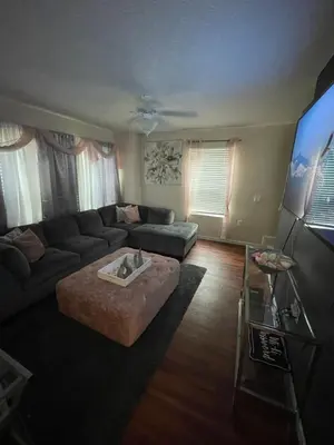 a living room with a couch and a table at Home sweet home in Columbus