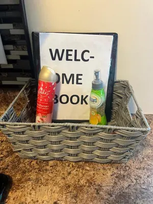 a basket with drinks and a sign on a counter at Home sweet home in Columbus