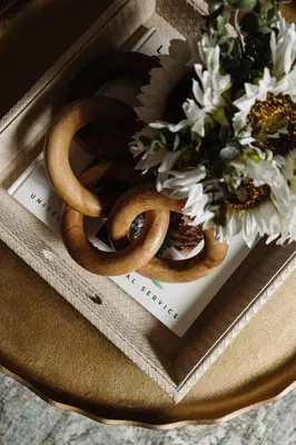a bowl of pretzels and flowers on a table at Maple Heights Gem Libby Unit 1 in Maple Heights