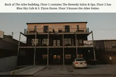 a building with a car parked in front of it at The Atlee Suites in Millersburg