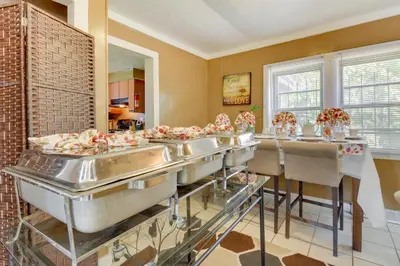 a kitchen with a row of sinks in a room at Cincinnati Home Rental with Balcony and Fire Pit! in Cincinnati
