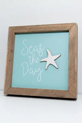 a sign that says seas the day with a starfish at Bluebirds Road to Happiness in Vermilion