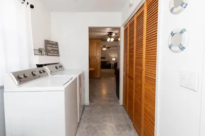 a laundry room with a washer and dryer at Bluebirds Road to Happiness in Vermilion