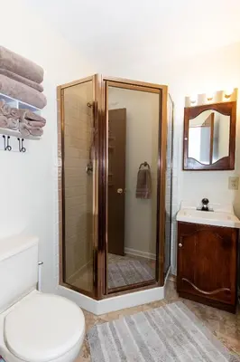 a bathroom with a shower and a toilet and a sink at Bluebirds Road to Happiness in Vermilion