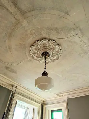 a ceiling with a chandelier in a room at The Vistula Rose B & B in Toledo