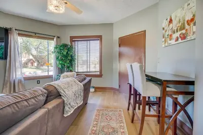 a living room with a couch and a table at Jetted Tub Dayton Condo, 2 Mi to Oregon District in Dayton