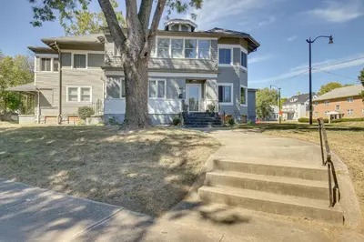 a house with a tree in front of it at Jetted Tub Dayton Condo, 2 Mi to Oregon District in Dayton