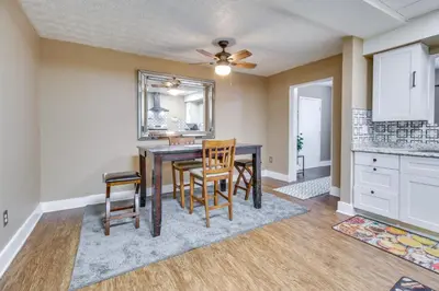 a kitchen and dining room with a table and chairs at Convenient Dayton Vacation Rental Near Downtown! in Dayton