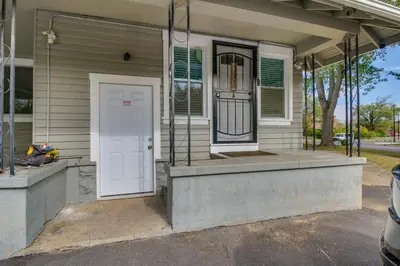 a front porch of a house with a white door at Convenient Dayton Vacation Rental Near Downtown! in Dayton