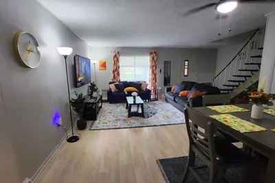 a living room with a couch and a table at Tastefully Furnished 3bd @Euclid in Euclid