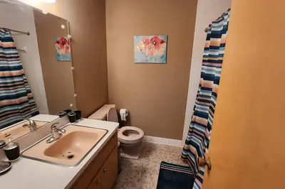 a bathroom with a sink and a toilet at Tastefully Furnished 3bd @Euclid in Euclid