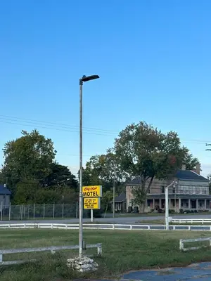 a street light with a motel sign on the side of a road at CITY VIEW MOTEL in Centerville