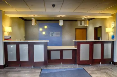 a lobby with a bar in a hospital at Holiday Inn Express Sidney by IHG in Sidney
