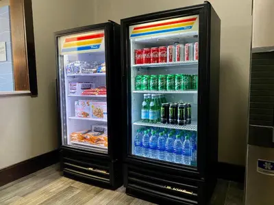 a refrigerator filled with lots of water and soda at Holiday Inn Express Sidney by IHG in Sidney