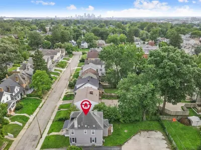 an aerial view of a house with a road sign on it at The Indiana Stunner in Columbus
