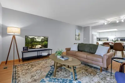a living room with a couch and a table at The Highmeadow Retreat in Gahanna