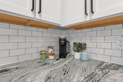 a kitchen counter top with a coffee maker on it at The Schumacher Townhouse - 2 BR in Columbus