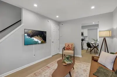 a living room with a couch and a table at The Schumacher Place - NEW 2 BR in Columbus