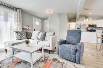 a living room with a couch and a chair and a table at 5 Mi to The USAF Museum Dayton Home, Walk to Park in Dayton