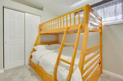 a bedroom with a bunk bed with a ladder at 5 Mi to The USAF Museum Dayton Home, Walk to Park in Dayton