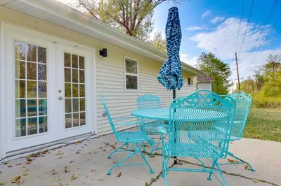 a blue table and chairs on a patio at 5 Mi to The USAF Museum Dayton Home, Walk to Park in Dayton
