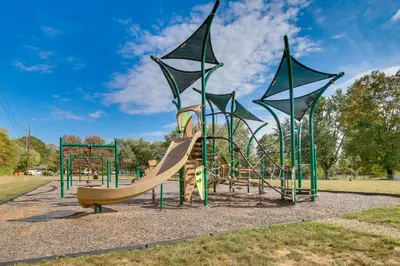 a playground with a slide in a park at 5 Mi to The USAF Museum Dayton Home, Walk to Park in Dayton