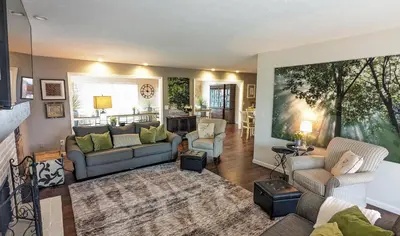 a living room with a couch and chairs in it at 5 Bedroom Family Gathering Home with Indoor Hot Tub in Huron