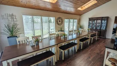 a large dining room with a large table and chairs at 5 Bedroom Family Gathering Home with Indoor Hot Tub in Huron