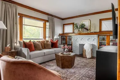 a living room with a couch and a fireplace at Stunning 3BR - Near Cleveland Clinic Main Campus in Cleveland Heights