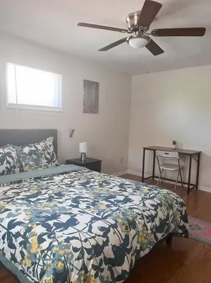 a bedroom with a bed and a ceiling fan at Cozy 2 Bedroom in Cleveland in Cleveland Heights