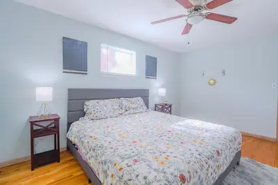 a bedroom with a bed and a ceiling fan at Charming 2 Bed Room in Cleveland in Cleveland Heights