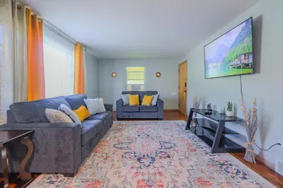 a living room with a couch and a table at Charming 2 Bed Room in Cleveland in Cleveland Heights