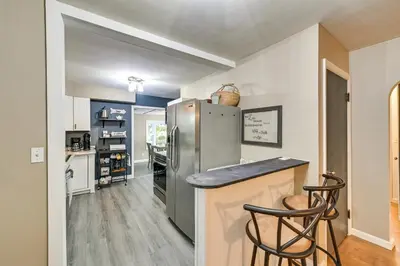 a kitchen with a stainless steel refrigerator and a counter at Dry Ridge Rental Home with Hot Tub and Game Room! in Dry Ridge