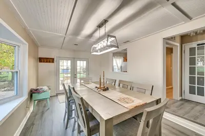 a dining room with a large wooden table and chairs at Dry Ridge Rental Home with Hot Tub and Game Room! in Dry Ridge